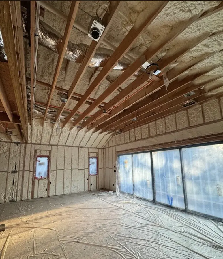 Interior walls and ceiling insulated with spray foam during new construction in West Miami